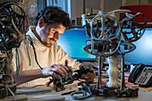 Engineer working on Romeo robot thorax