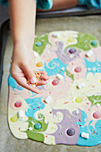 Kid preparing white chocolate unicorn bark