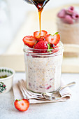 Overnight oats with strawberries and maple syrup