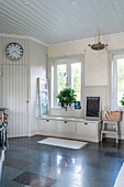 Bench with drawers below window in large country-house kitchen