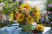 Bouquet of sunflowers, dahlias, fennel flowers, viburnum berries and blackberries