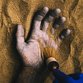 Forensic expert discovering body buried in sand