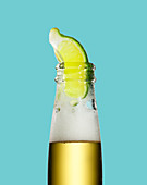 Lime in neck of bottle of beer