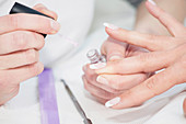Woman having manicure