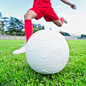 Soccer player kicking ball