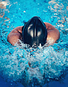 Woman swimming breaststroke