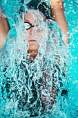 Woman swimming backstroke