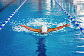 Woman swimming butterfly