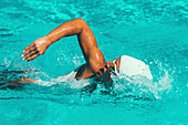 Woman swimming front crawl