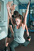 Woman doing TRX workout