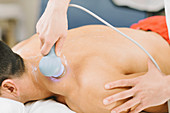 Physiotherapist using ultrasound