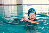 Boy in swimming class