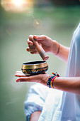 Woman with Tibetan singing bowl