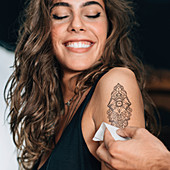 Woman with temporary tattoo