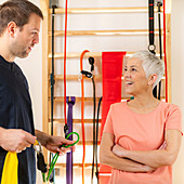 Senior woman with personal trainer