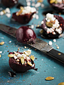 Beetroots with cheese and knife on table