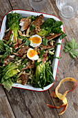 Salad with smoked mackerel, apple, eggs and lime dressing