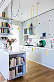 White, modern kitchen with bright colourful accents