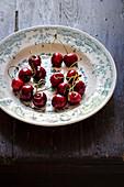Fresh cherries in a ceramic plate
