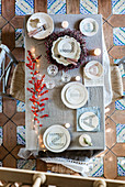 Plates decorated with letters on festively decorated table