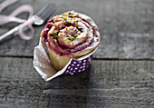 Vegan yeast snail with blackberry and cream cheese filling and pistachios