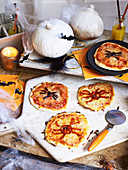 Homemade halloween spider pizzas