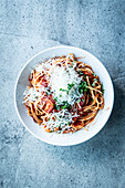 Noodles with tomato sauce and grated cheese