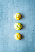 A row of three halved lemons
