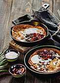 Dutch Baby with coconut chips, coconut yoghurt and plums