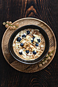 Overnight oats with redcurrants, blueberries and flaked almonds