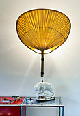 Yellow fan lamp with ceramic polar bear as base