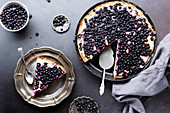 Top view image of blueberry tart with cream