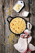 Classic american dish baked mac and cheese in cast iron pan