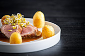 Duroc sirloin with orange ginger soy and potatoes