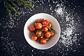 Fresh cherry tomatoes sauteed with green asparagus and rosemary