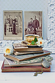 Roses and coffee cup on old books