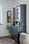 Grey dresser in country-house style in dining room