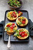 Parmesan tartlets with tomatoes and caramelised walnuts