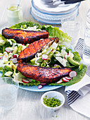 Grilled salmon on fresh salad