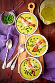 Green peas cream soup with gorgonzola and caramelized bacon