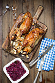 Duck with apple and onion filling and red cabbage
