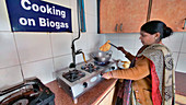 Cooking using biogas from a toilet in India