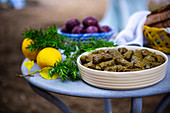 easter table with dolmas, easter eggs and freshly baked bread