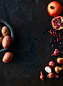 Shalotts, pomegranate kernels and red potatoes