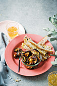 Marinated brinjal and olive bowl with melba toast