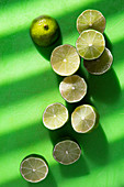 Lime halves on a green surface