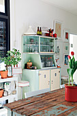 Retro dresser and wooden table in kitchen area