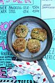 Vegetable fritters in a pan