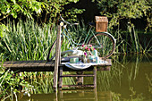 Picnic on jetty of idyllic lake