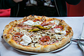 pizza with burrata and salami